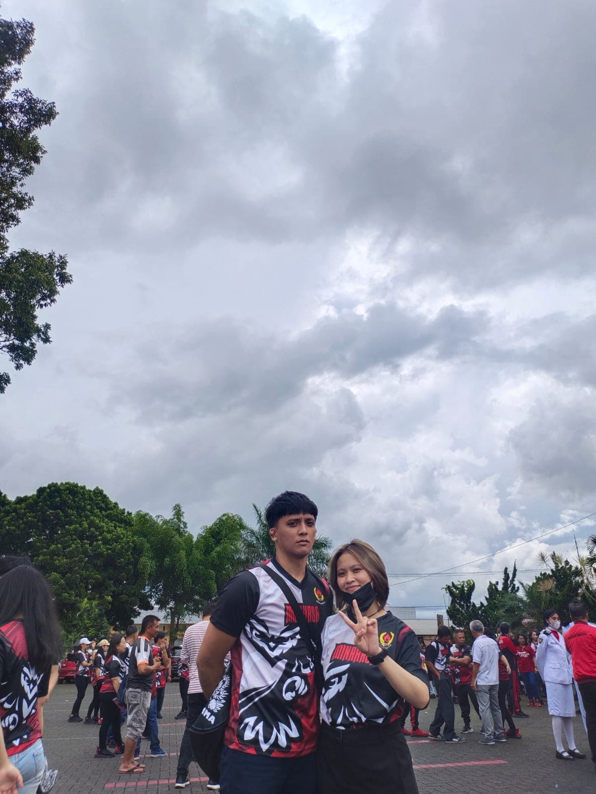 Brenda and Marck wearing matching Minahasa sports jerseys