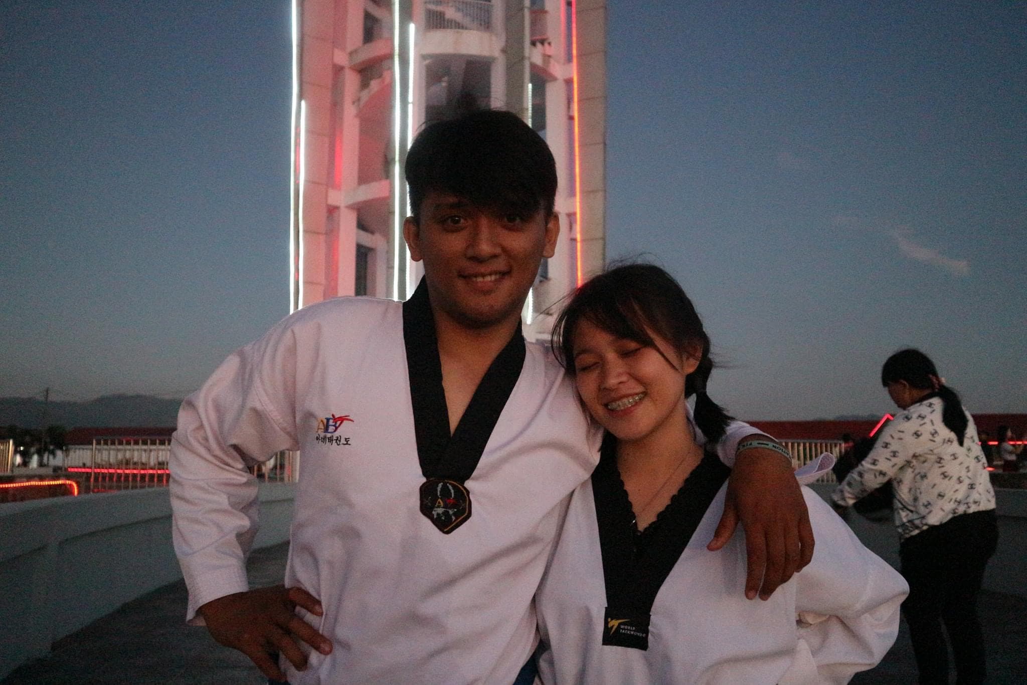 Brenda and Marck embracing after taekwondo practice